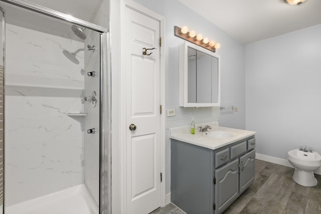 bathroom with a bidet, hardwood / wood-style floors, vanity, tiled shower, and decorative backsplash