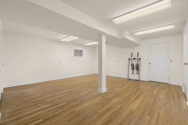 basement with wood-type flooring