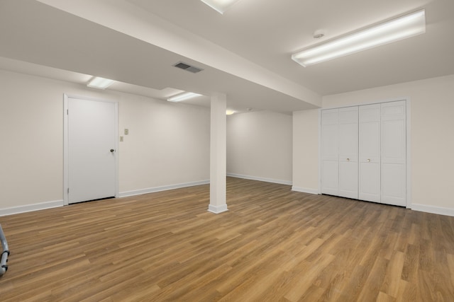 basement featuring light hardwood / wood-style floors