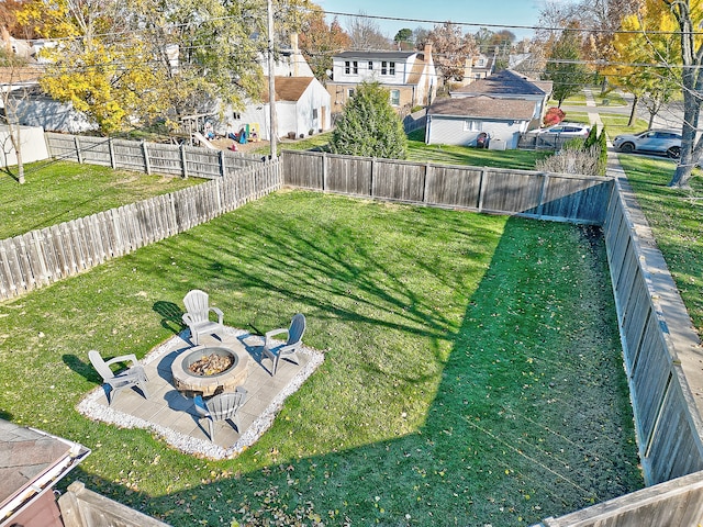 view of yard with a fire pit and a patio area