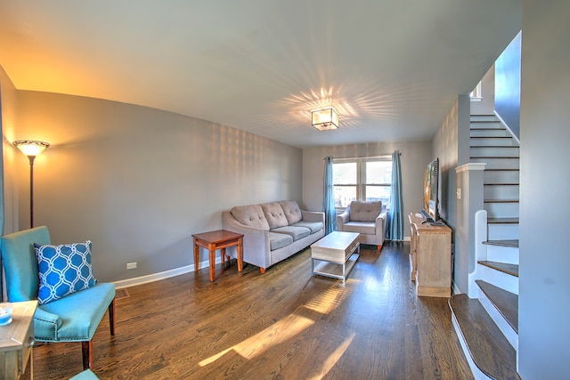 living room featuring dark wood-type flooring