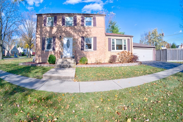 view of front of property featuring a garage and a front yard