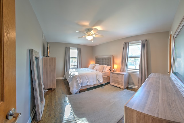 bedroom featuring ceiling fan and dark hardwood / wood-style floors