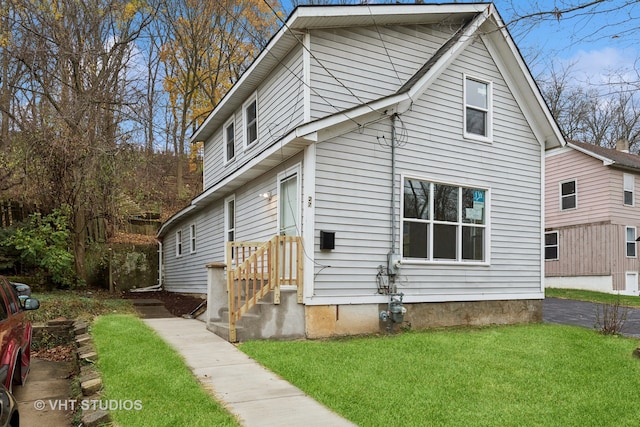 view of side of home featuring a yard