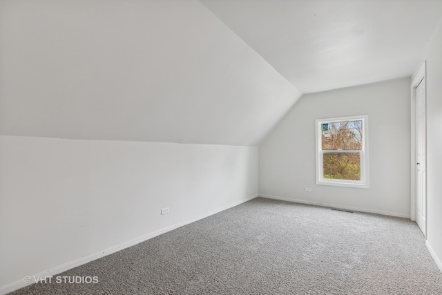 bonus room featuring carpet and lofted ceiling