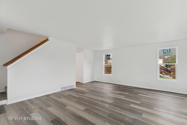 unfurnished living room featuring wood-type flooring