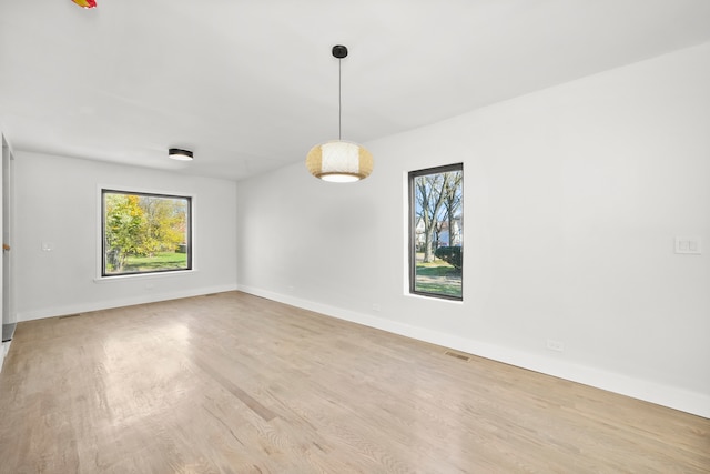 spare room with light wood-type flooring