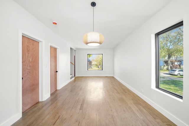 unfurnished room with light hardwood / wood-style flooring