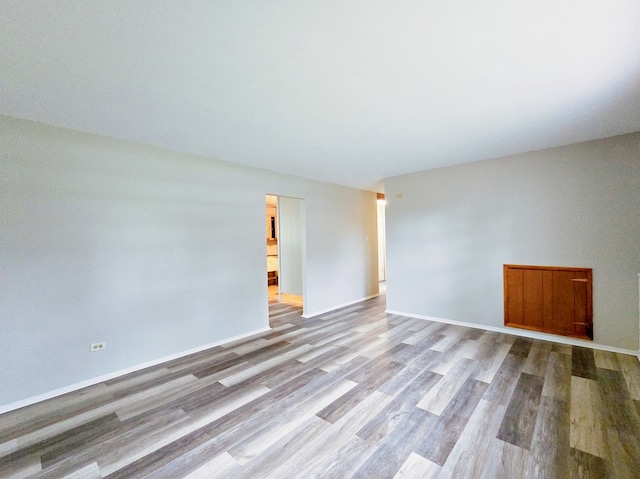 unfurnished room featuring light hardwood / wood-style flooring