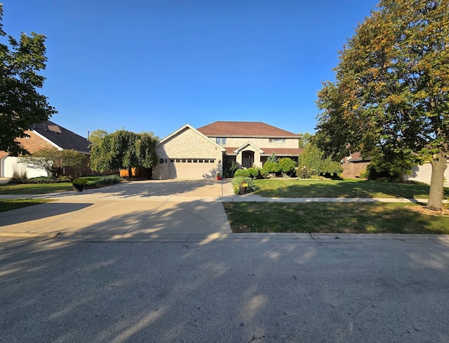 view of front of house featuring a garage and a front yard