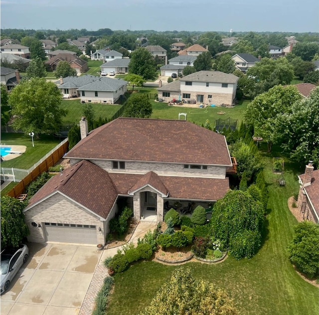 birds eye view of property with a residential view