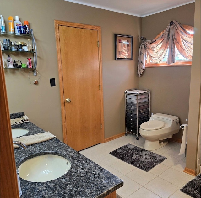 full bathroom featuring toilet, a closet, vanity, and tile patterned floors