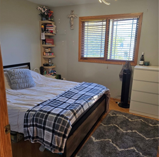 bedroom featuring wood finished floors