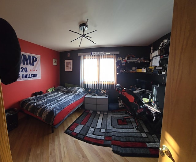 bedroom with wood finished floors