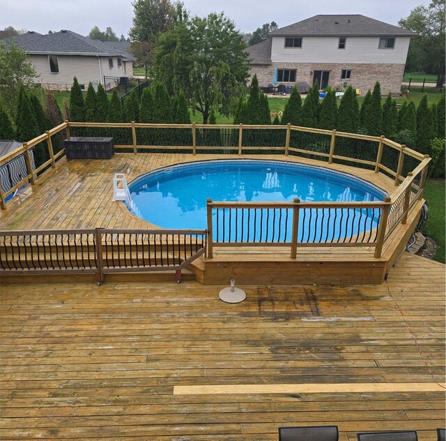 view of pool featuring a wooden deck