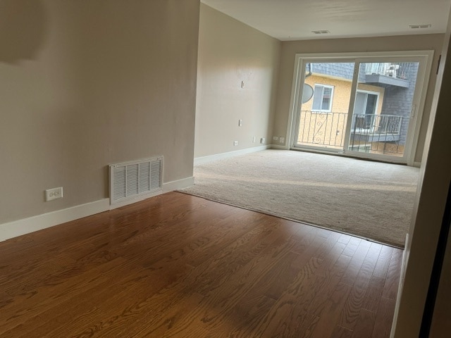 unfurnished room featuring wood-type flooring