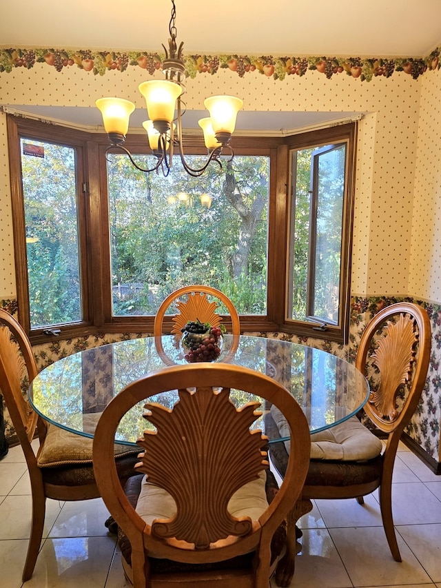 dining space with light tile patterned floors and an inviting chandelier