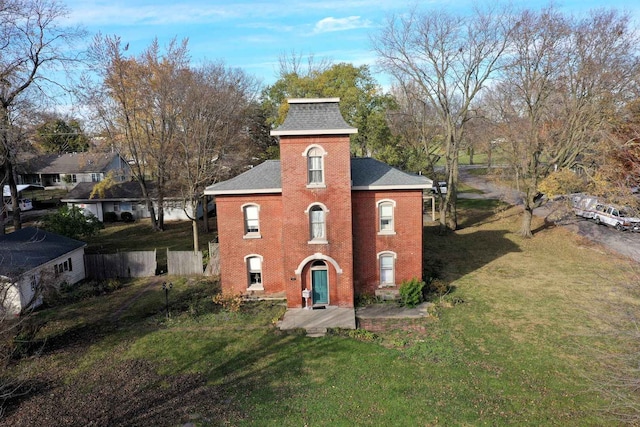 view of outbuilding featuring a lawn