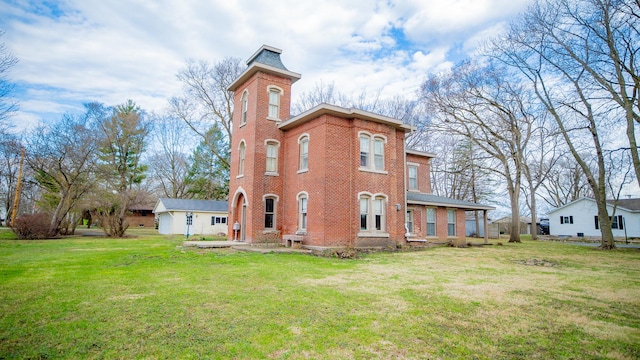 608 E Ash St, Fairbury, IL 61739 - back of property with a yard and brick siding