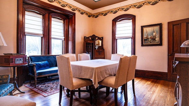 608 E Ash St, Fairbury, IL 61739 - dining room with baseboards, ornamental molding, and wood-type flooring