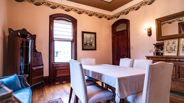 608 E Ash St, Fairbury, IL 61739 - dining space featuring crown molding and wood finished floors