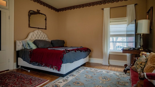 608 E Ash St, Fairbury, IL 61739 - bedroom with wood finished floors and baseboards