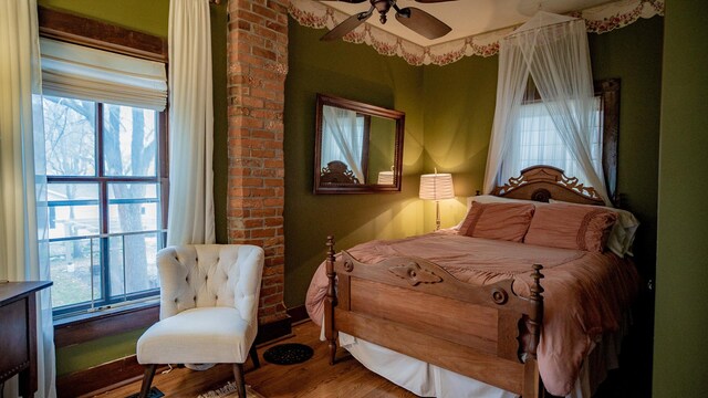 608 E Ash St, Fairbury, IL 61739 - bedroom with wood finished floors, ceiling fan, and multiple windows