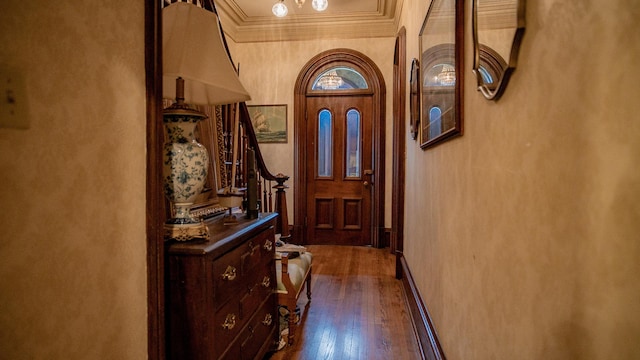 608 E Ash St, Fairbury, IL 61739 - hallway featuring crown molding, dark wood-style floors, and stairs