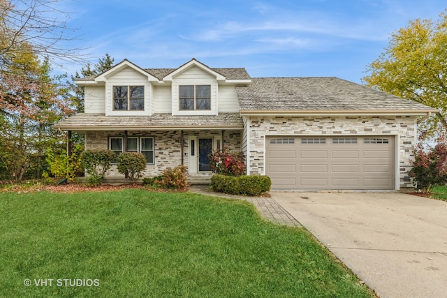 front of property with a garage and a front lawn