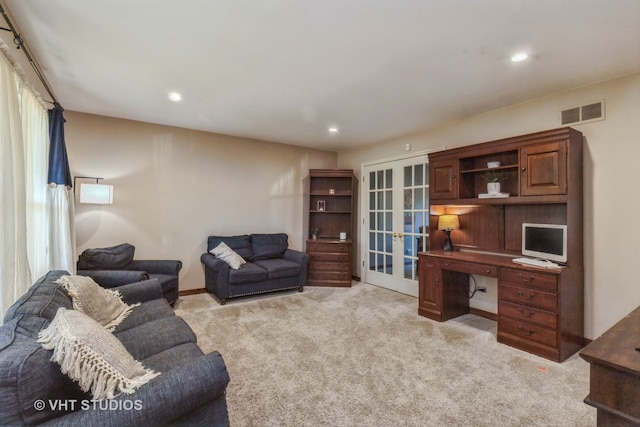 carpeted living room featuring french doors