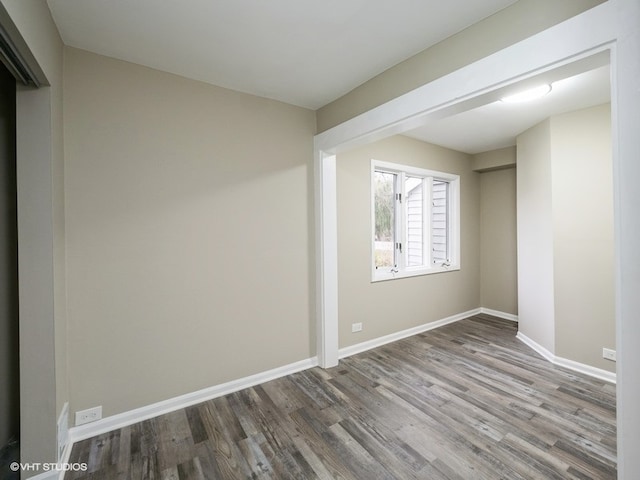 spare room featuring hardwood / wood-style floors