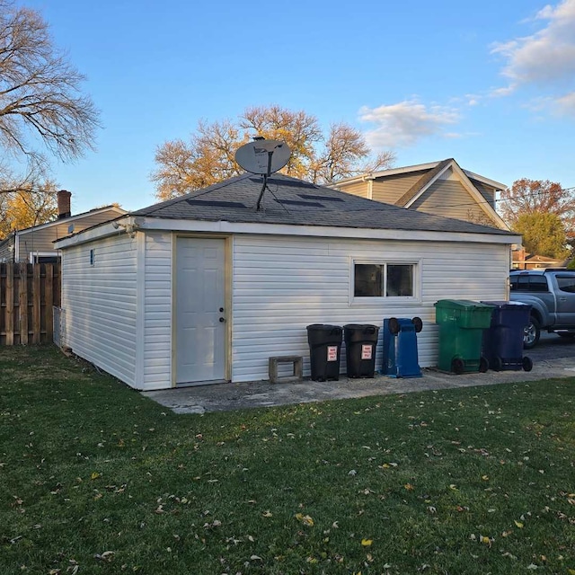 rear view of property with a yard