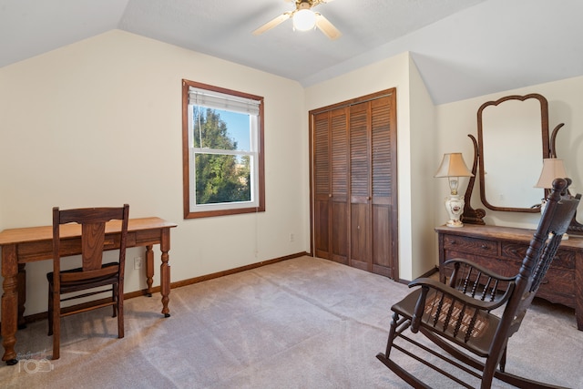 office space featuring ceiling fan, light colored carpet, and lofted ceiling