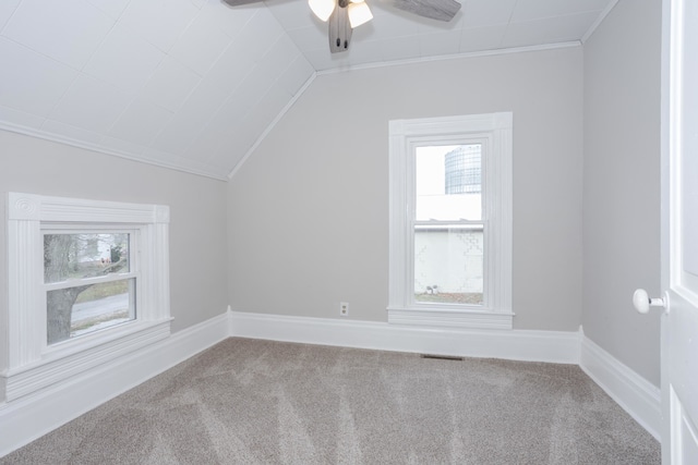 additional living space featuring carpet floors, ceiling fan, and lofted ceiling