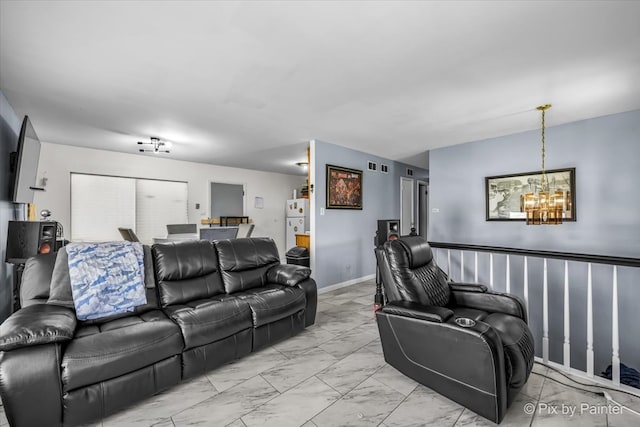 living room featuring an inviting chandelier