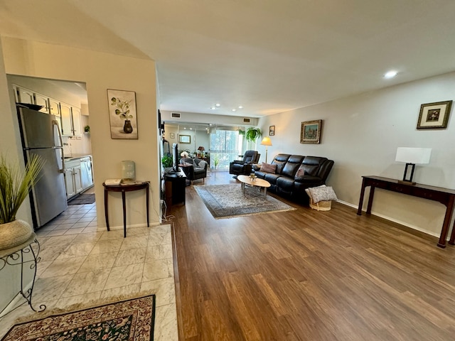 living room with light hardwood / wood-style floors