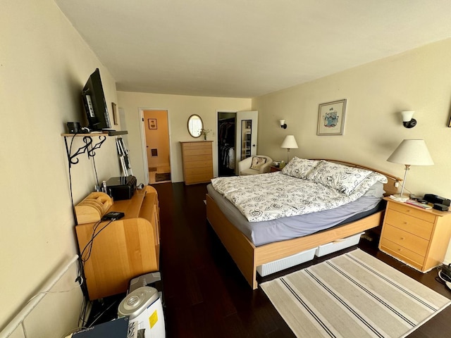 bedroom featuring dark hardwood / wood-style flooring