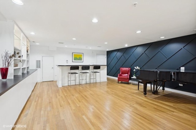 interior space with built in features and light hardwood / wood-style flooring