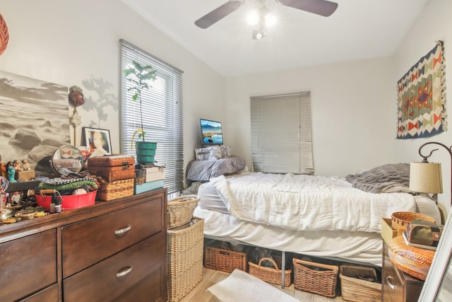 bedroom featuring ceiling fan and light hardwood / wood-style flooring