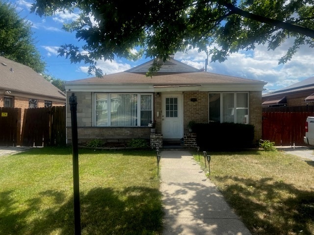 bungalow with a front yard