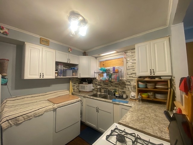 kitchen featuring white cabinetry, white appliances, backsplash, and ornamental molding