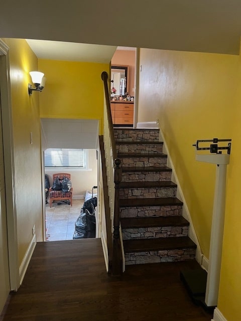 stairs with wood-type flooring