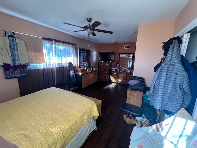 bedroom featuring dark wood-type flooring and ceiling fan