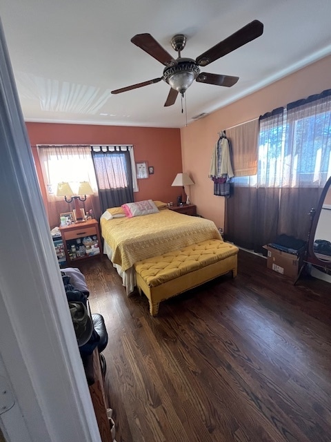 bedroom featuring ceiling fan and dark hardwood / wood-style floors