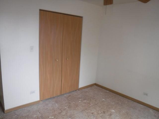 unfurnished bedroom featuring a closet