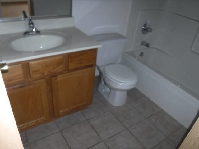 full bathroom featuring tile patterned floors, vanity,  shower combination, and toilet