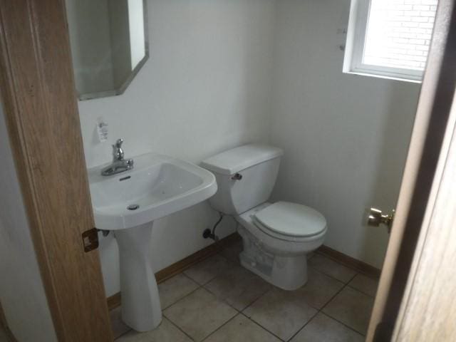 bathroom featuring tile patterned flooring and toilet