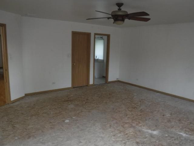 spare room with ceiling fan