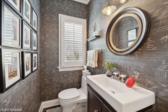 bathroom featuring vanity and toilet