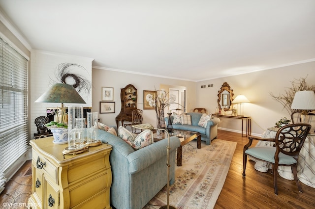 living room with ornamental molding and hardwood / wood-style flooring